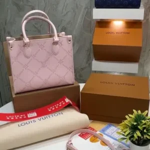 Pink monogram tote bag with accessories